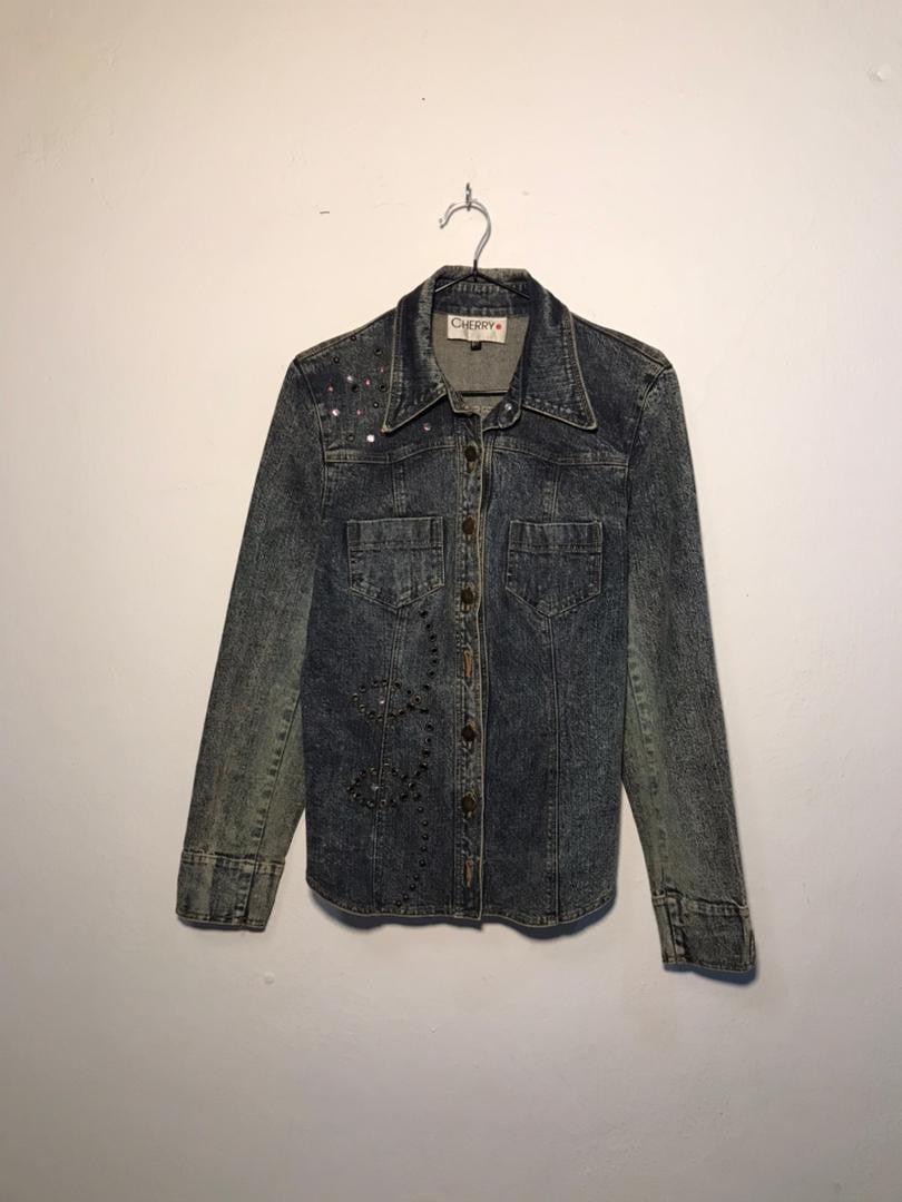 SPIRAL STORE blue denim jacket with embellished details on chest and collar, button-up front, and two chest pockets.