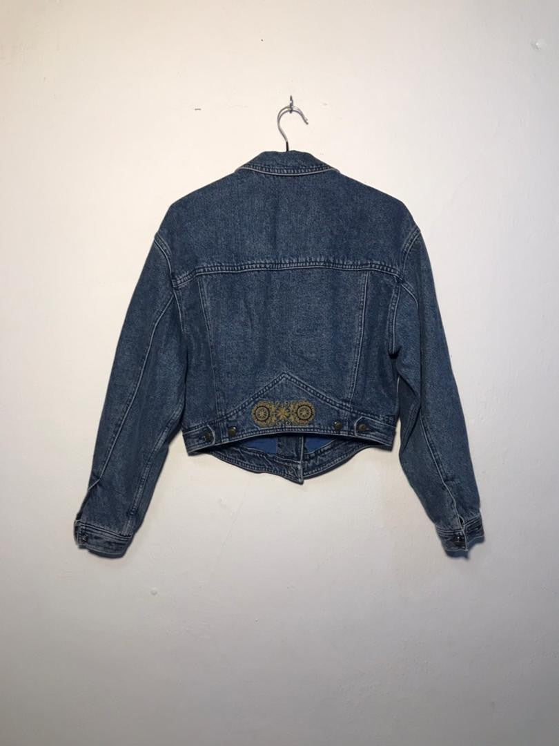 SPIRAL STORE blue denim jacket with embroidered detail on back yoke. Classic collar, button front, and long sleeves.