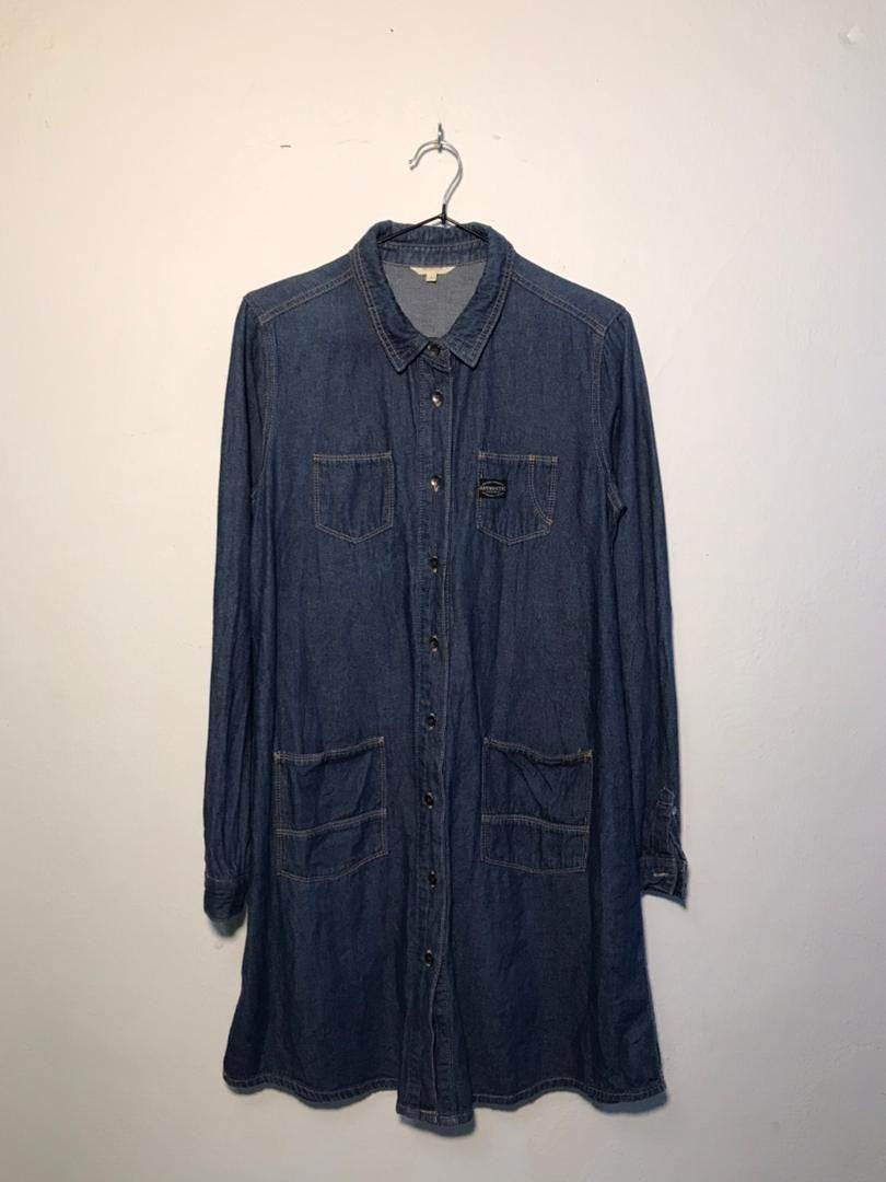 SPIRAL STORE blue denim shirt dress with button front, collar, long sleeves, and four front pockets.