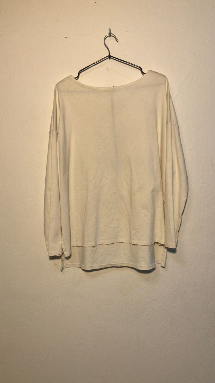 SPIRAL STORE cream long sleeve oversized t-shirt with a raw hem and crew neck.