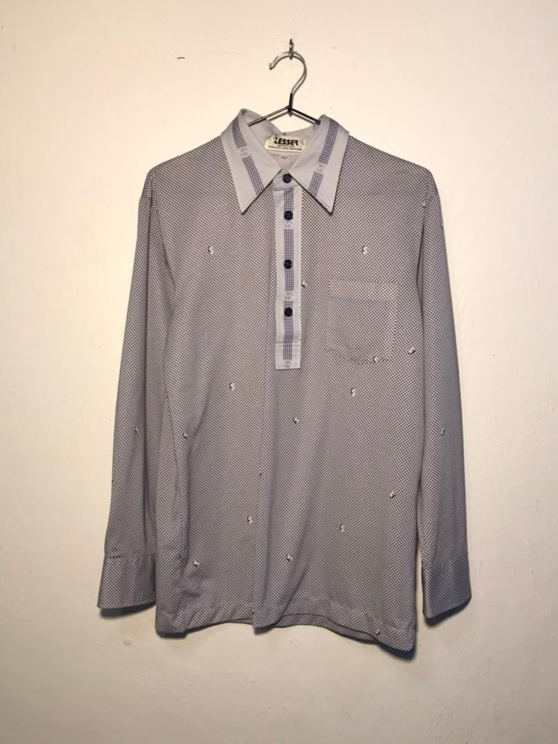 SPIRAL STORE men's long sleeve collared shirt with all-over dollar sign pattern and chest pocket.