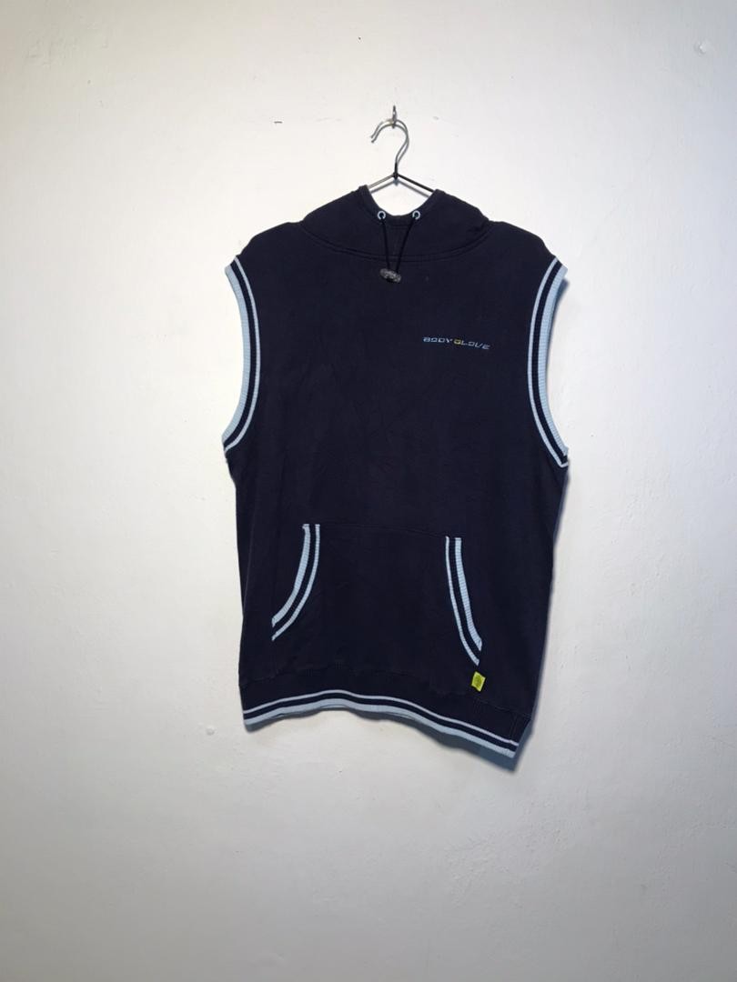 SPIRAL STORE navy blue sleeveless hoodie with drawstring hood, kangaroo pocket, and light blue trim. Cotton blend.