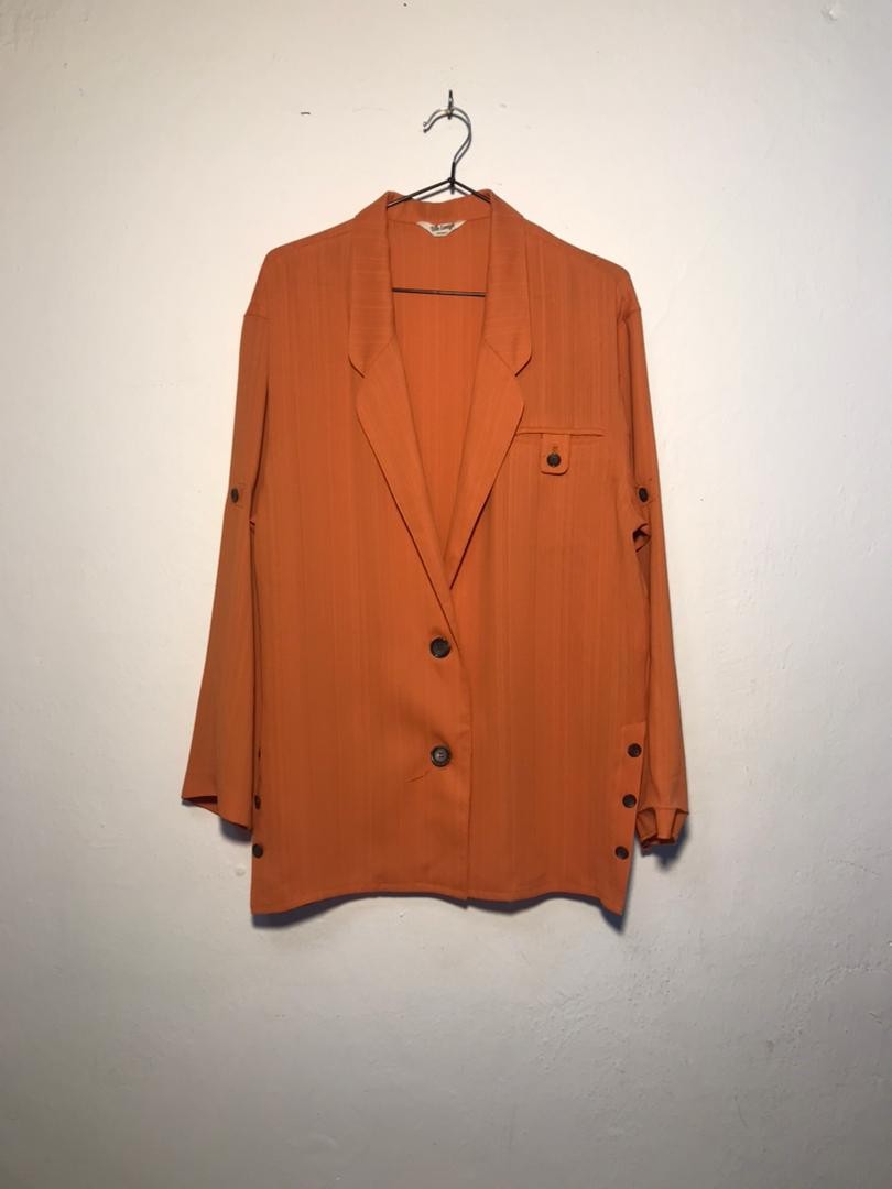 SPIRAL STORE orange textured blazer with button closure and pocket detail