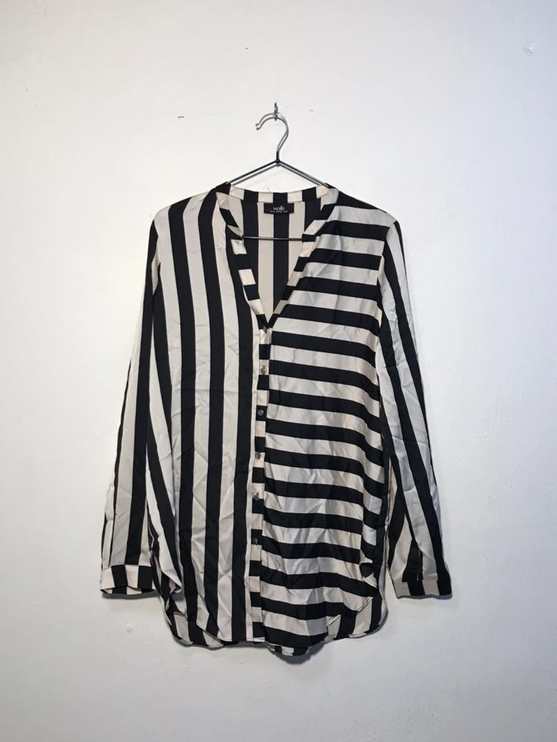 SPIRAL STORE black and white striped long sleeve collared shirt with button front closure.